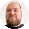 WPF Community - Ein Mann mit Bart blickt nach oben.